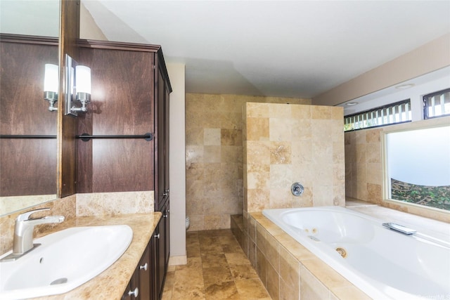 1175 Palea Way, Honolulu, HI 96825 - bathroom with a jetted tub, vanity, and tile walls