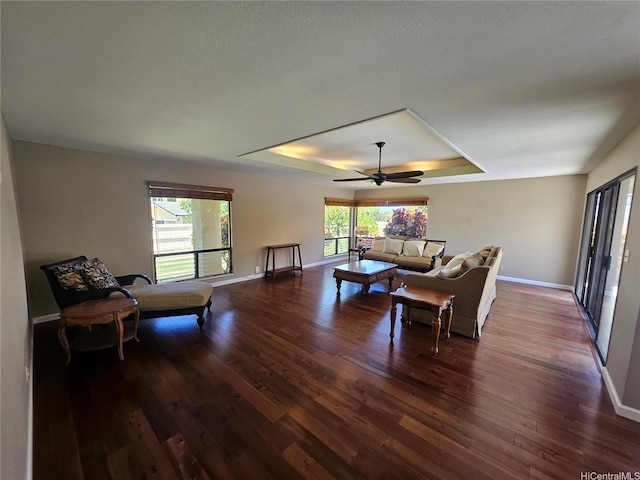 1175 Palea Way, Honolulu, HI 96825 - living room with a raised ceiling, dark wood-style flooring, and a ceiling fan