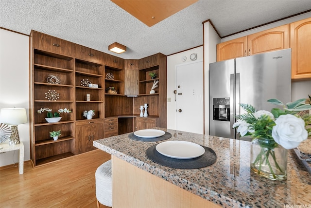 775 Kinalau Pl Unit 1907, Honolulu, HI 96813 - kitchen with stainless steel refrigerator with ice dispenser, open shelves, light wood-type flooring, light stone counters, and a textured ceiling