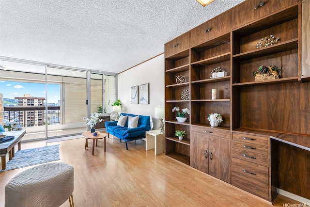 775 Kinalau Pl Unit 1907, Honolulu, HI 96813 - living area featuring expansive windows, wood finished floors, and a textured ceiling