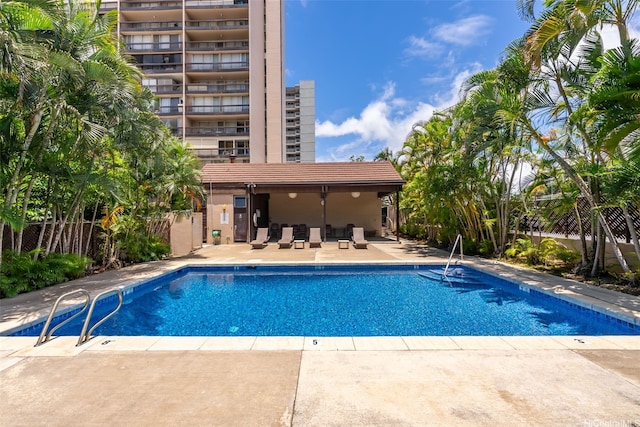 775 Kinalau Pl Unit 1907, Honolulu, HI 96813 - community pool with a patio and fence