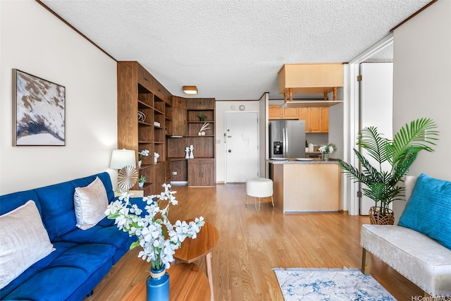 775 Kinalau Pl Unit 1907, Honolulu, HI 96813 - living room featuring a textured ceiling and light wood-type flooring