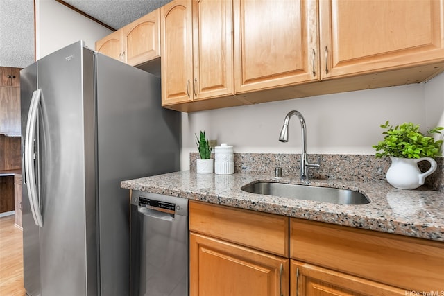 775 Kinalau Pl Unit 1907, Honolulu, HI 96813 - kitchen featuring stainless steel appliances, a sink, light stone counters, light wood-type flooring, and light brown cabinetry