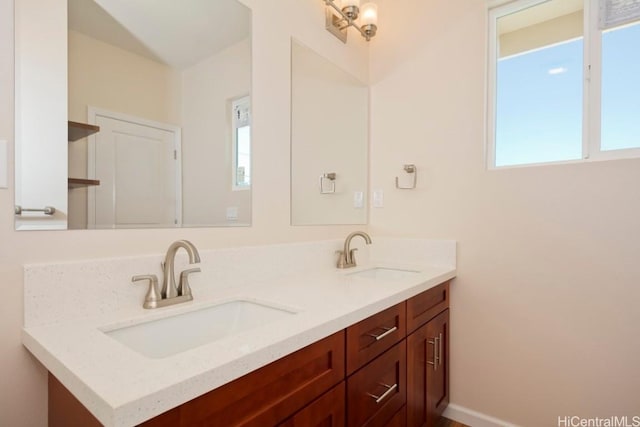 bathroom with vanity and plenty of natural light