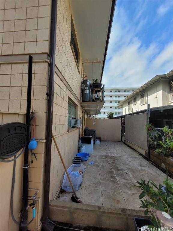 view of side of home featuring a patio area