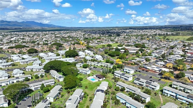 birds eye view of property with a mountain view