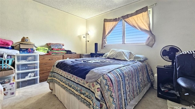 bedroom featuring a textured ceiling and light colored carpet