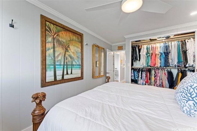 bedroom with ornamental molding, ceiling fan, and a closet