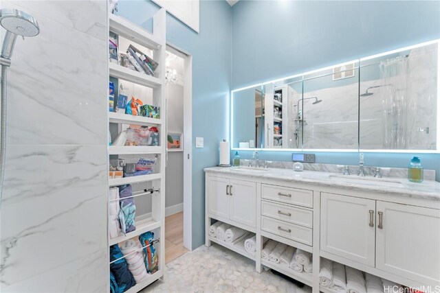 bathroom with a shower and vanity