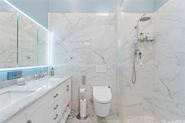 bathroom featuring tiled shower, vanity, toilet, and tile walls