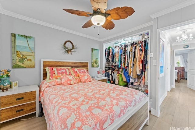 bedroom with crown molding, ceiling fan with notable chandelier, a closet, and light hardwood / wood-style flooring