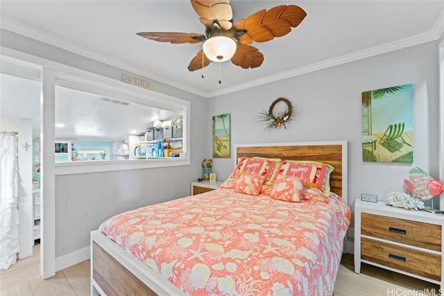 bedroom with ornamental molding and ceiling fan