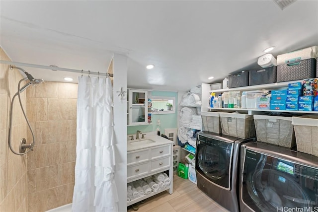 laundry area featuring sink and washing machine and clothes dryer