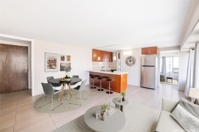 dining area featuring light tile patterned floors