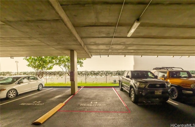 parking at dusk featuring a carport