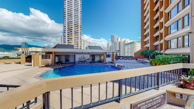 view of swimming pool featuring a patio area