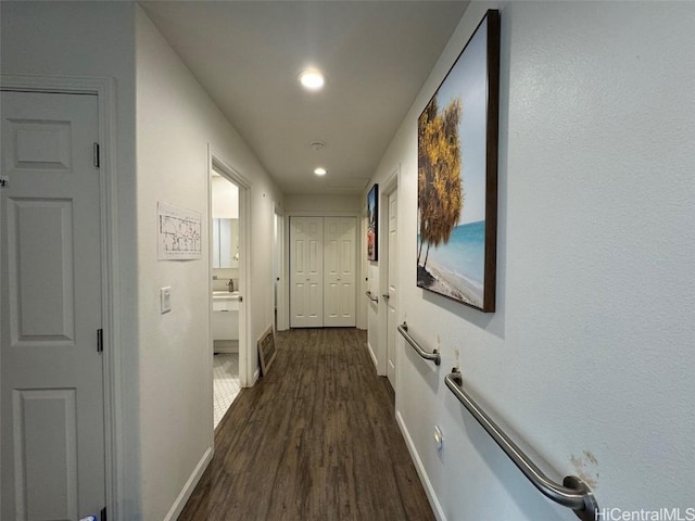 hallway featuring dark hardwood / wood-style floors