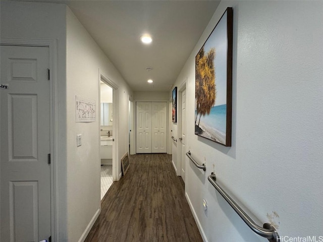 hallway featuring dark hardwood / wood-style flooring