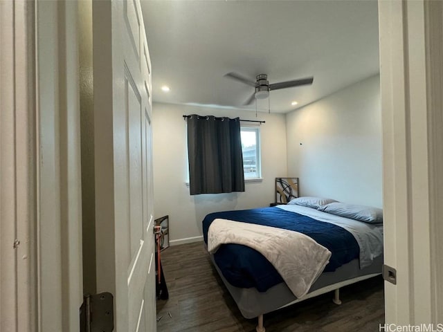 bedroom featuring dark hardwood / wood-style floors and ceiling fan