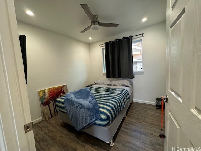 bedroom with ceiling fan and dark hardwood / wood-style flooring