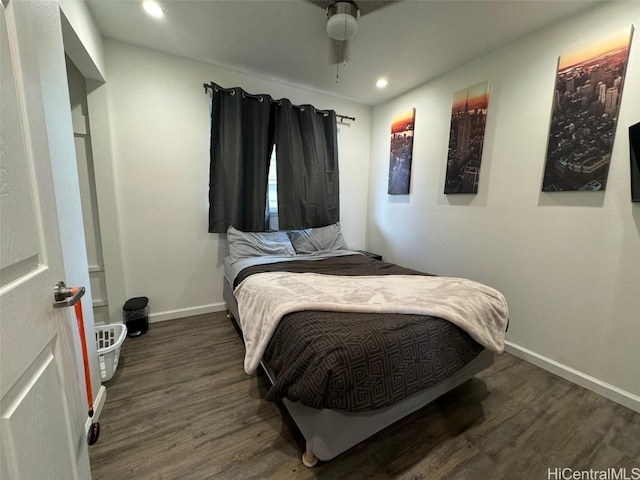 bedroom featuring ceiling fan and dark hardwood / wood-style flooring