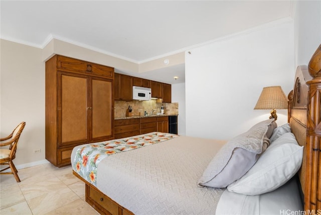 bedroom featuring crown molding and sink