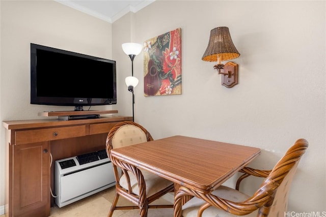 dining space featuring crown molding