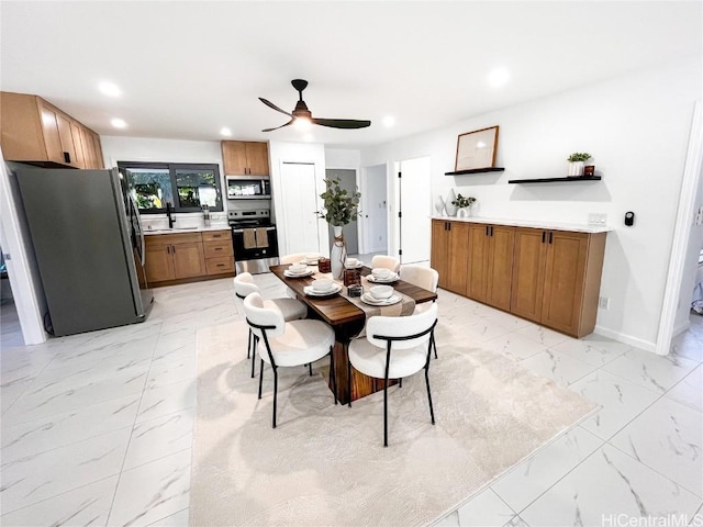 dining room with sink and ceiling fan