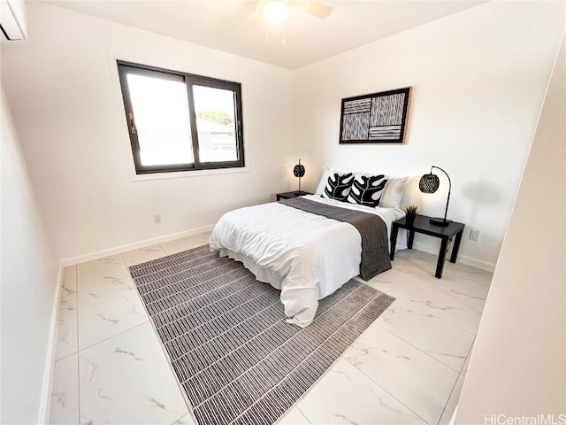 bedroom featuring ceiling fan and a wall unit AC