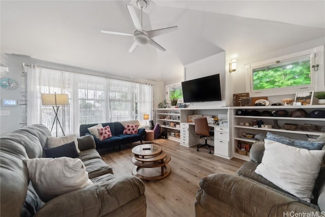 living room featuring high vaulted ceiling, ceiling fan, and light wood-type flooring