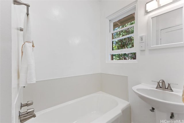 bathroom with sink and a bathtub