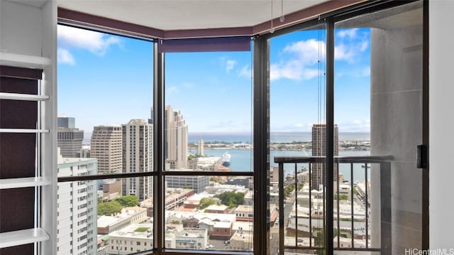 unfurnished sunroom with a water view