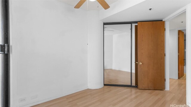 unfurnished bedroom featuring light hardwood / wood-style flooring and ceiling fan