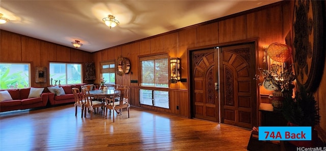 74 Makaweo Ave, Wahiawa, HI 96786 - dining space featuring lofted ceiling, wooden walls, and wood finished floors
