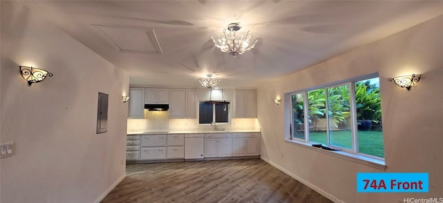74 Makaweo Ave, Wahiawa, HI 96786 - kitchen featuring white cabinets, dishwasher, wood finished floors, light countertops, and a sink