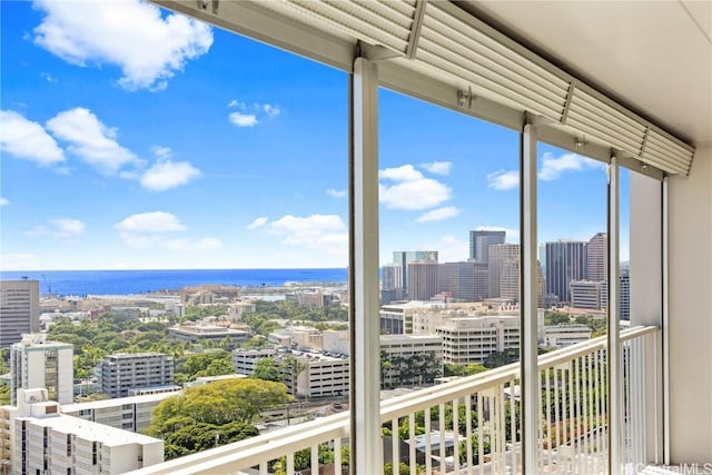 interior space featuring a water view and a city view