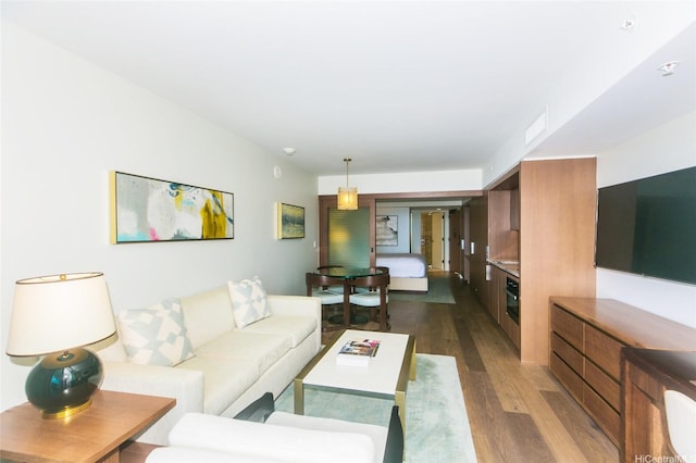2139 Kuhio Ave Unit 1810, Honolulu, HI 96815 - living area featuring dark wood finished floors