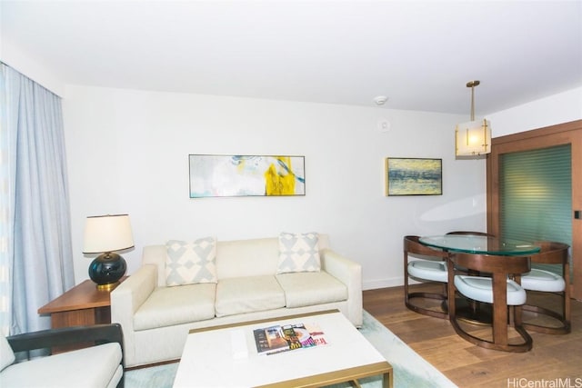 2139 Kuhio Ave Unit 1810, Honolulu, HI 96815 - living room with wood finished floors and baseboards