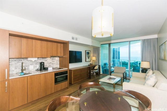 2139 Kuhio Ave Unit 1810, Honolulu, HI 96815 - living room featuring wood finished floors