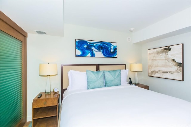 2139 Kuhio Ave Unit 1810, Honolulu, HI 96815 - bedroom with wood finished floors