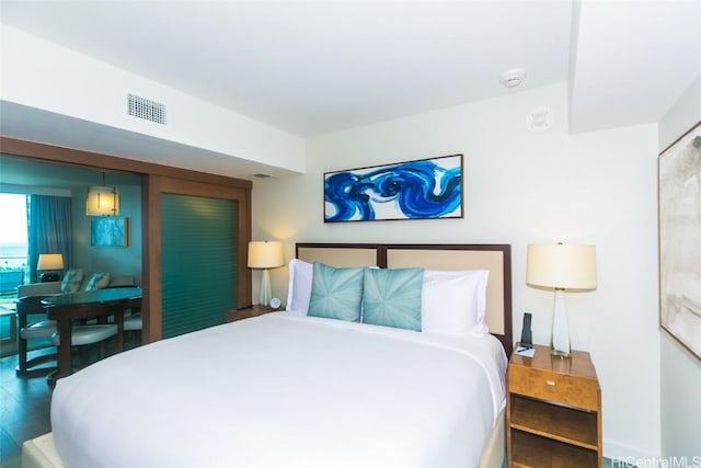 2139 Kuhio Ave Unit 1810, Honolulu, HI 96815 - bedroom featuring wood finished floors