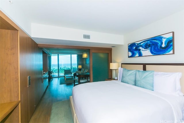 2139 Kuhio Ave Unit 1810, Honolulu, HI 96815 - bedroom with wood finished floors and access to exterior