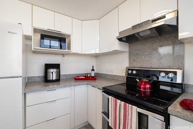 kitchen with white cabinetry, light stone counters, stainless steel range with electric cooktop, and white refrigerator