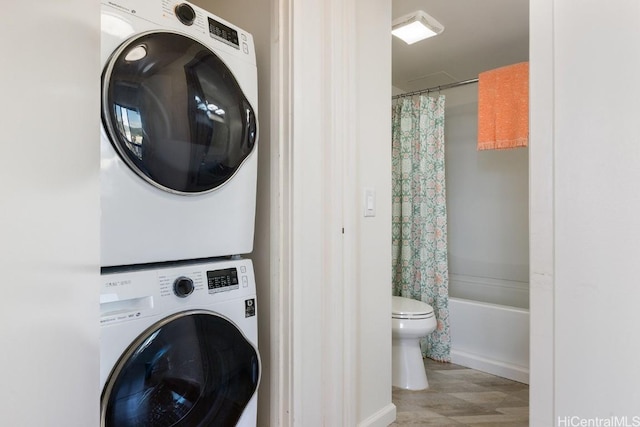 washroom with stacked washer and clothes dryer