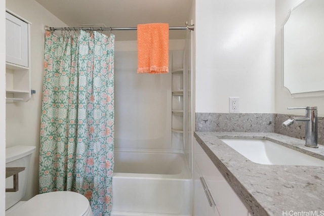 full bathroom featuring toilet, vanity, and shower / bathtub combination with curtain