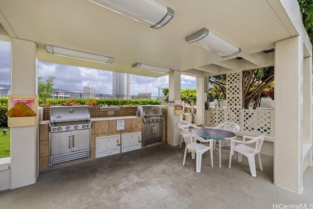 view of patio featuring a grill and an outdoor kitchen