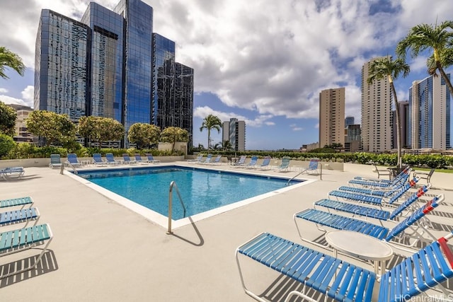 view of swimming pool with a patio area