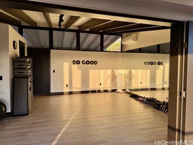 interior space featuring vaulted ceiling and hardwood / wood-style floors