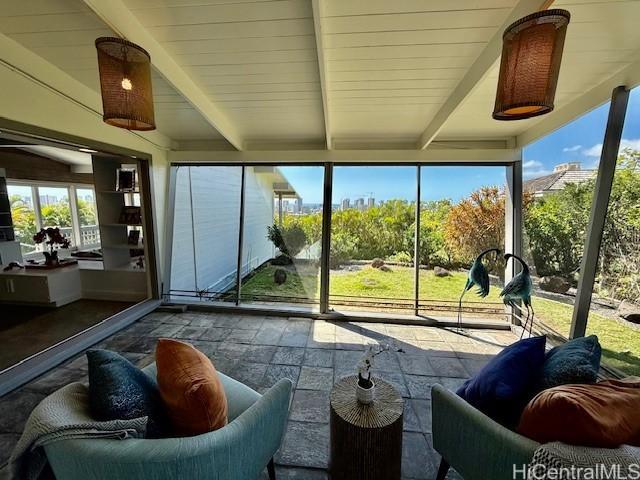 sunroom / solarium with beamed ceiling