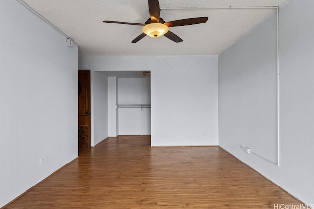 unfurnished room featuring wood-type flooring and ceiling fan